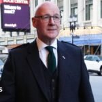 John Swinney defends £45,000 business-class flights to World Cup