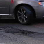 Extreme heat making UK roads sticky and worsening potholes, motoring chief warns