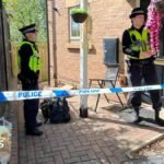 Four in court over murder of baby stabbed to death